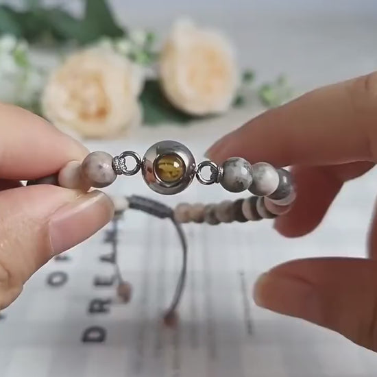 Video of the personalised photo projection bracelet showing the hidden photo and adjustable fit