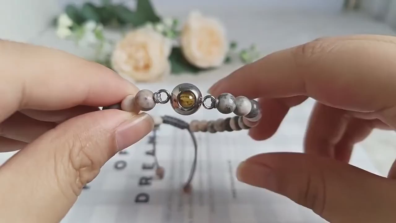 Video of the personalised photo projection bracelet showing the hidden photo and adjustable fit